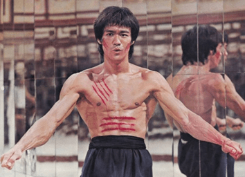 Fight Muscle Bruce Lee Posing | Fighting Arts Health Lab